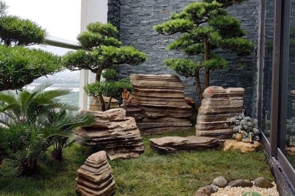đồi cỏ xanh, đá cuội nâu, cây cao nhỏ, sỏi