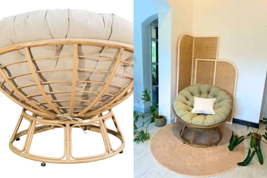 Ghế lười papasan khung mây nhựa đặt trong phòng khách, kết hợp thảm tròn và cây xanh tạo góc sinh hoạt ấm cúng.