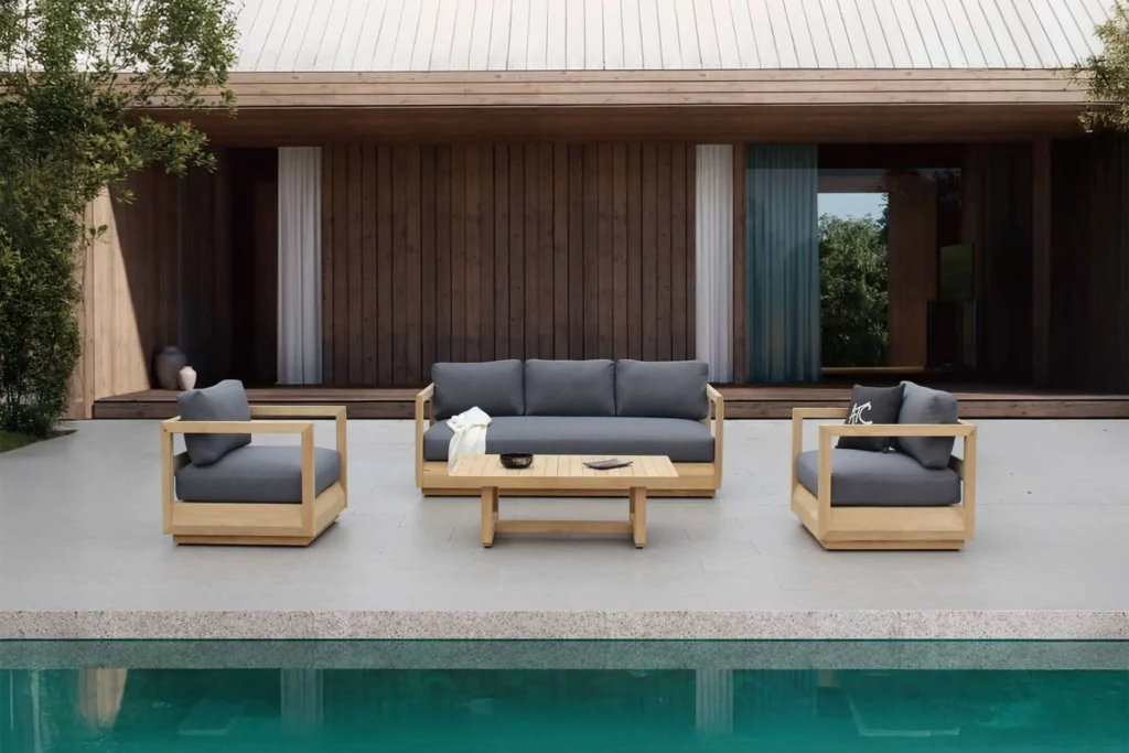 Bàn gỗ ngoài trời bằng gỗ teak cao cấp trong không gian biệt thự hiện đại.